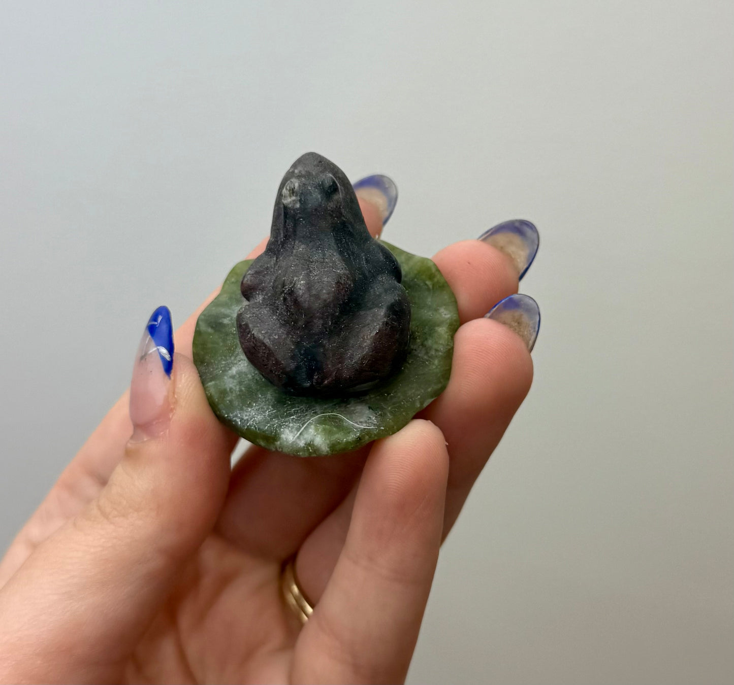 Garnet frog on a lily pad carving