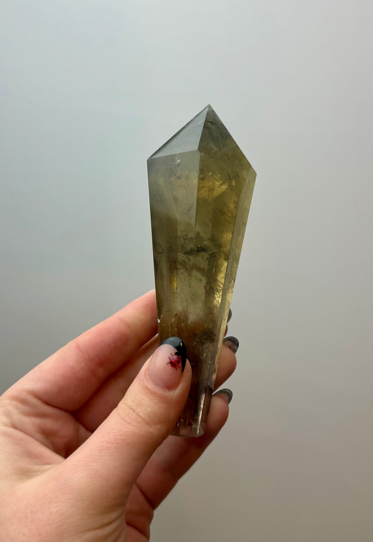 Smoky quartz wand on a stand