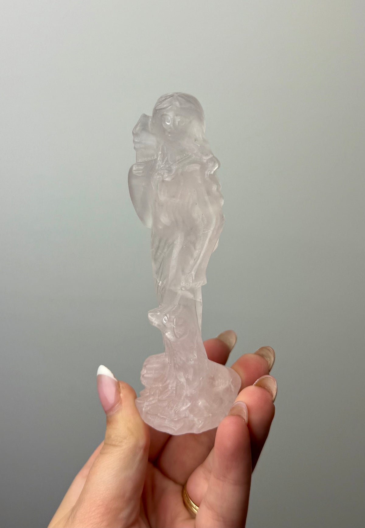 Rose quartz goddess with dog carving