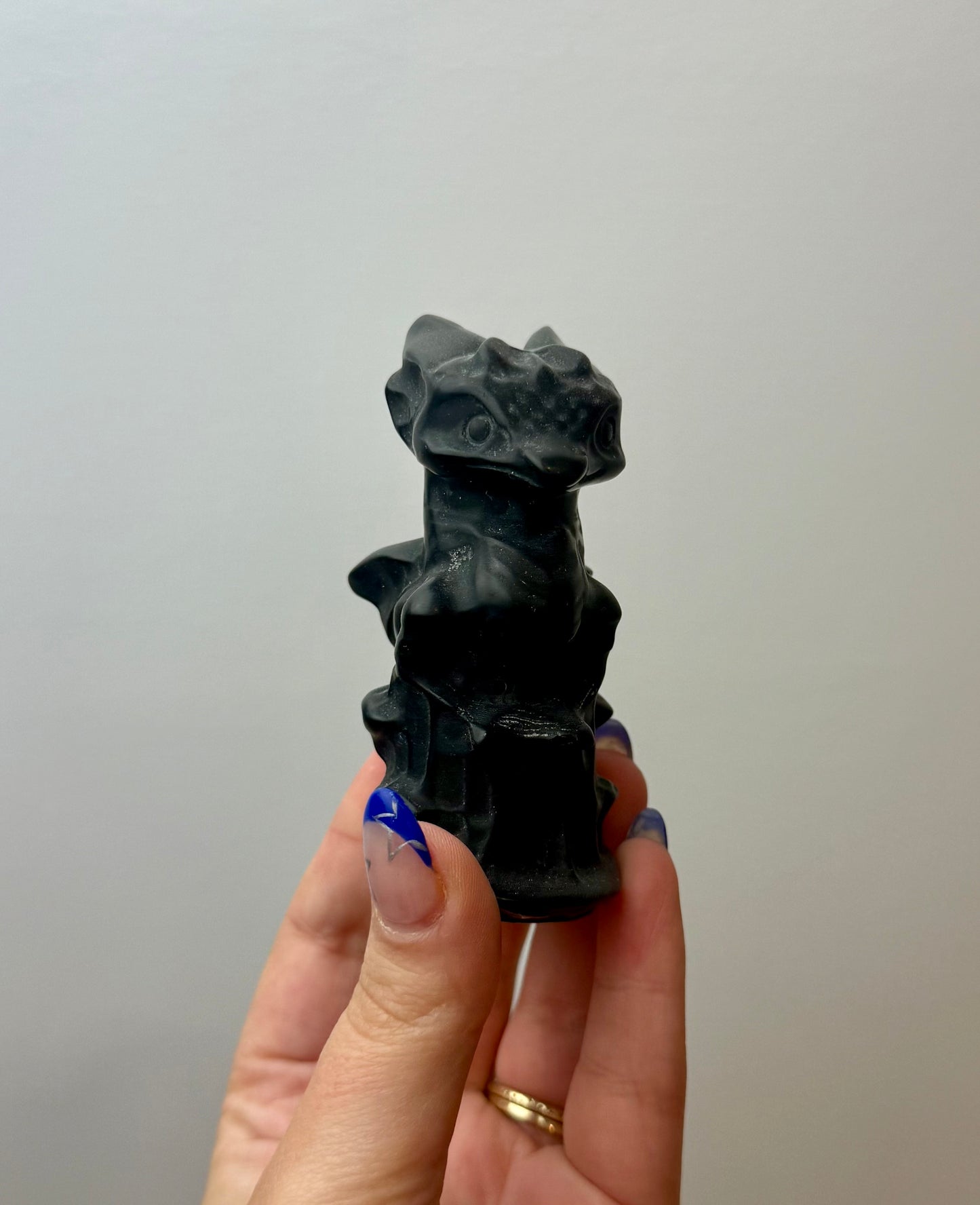 Obsidian dragon carving