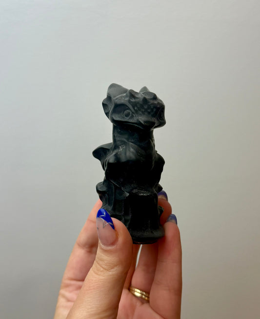 Obsidian dragon carving