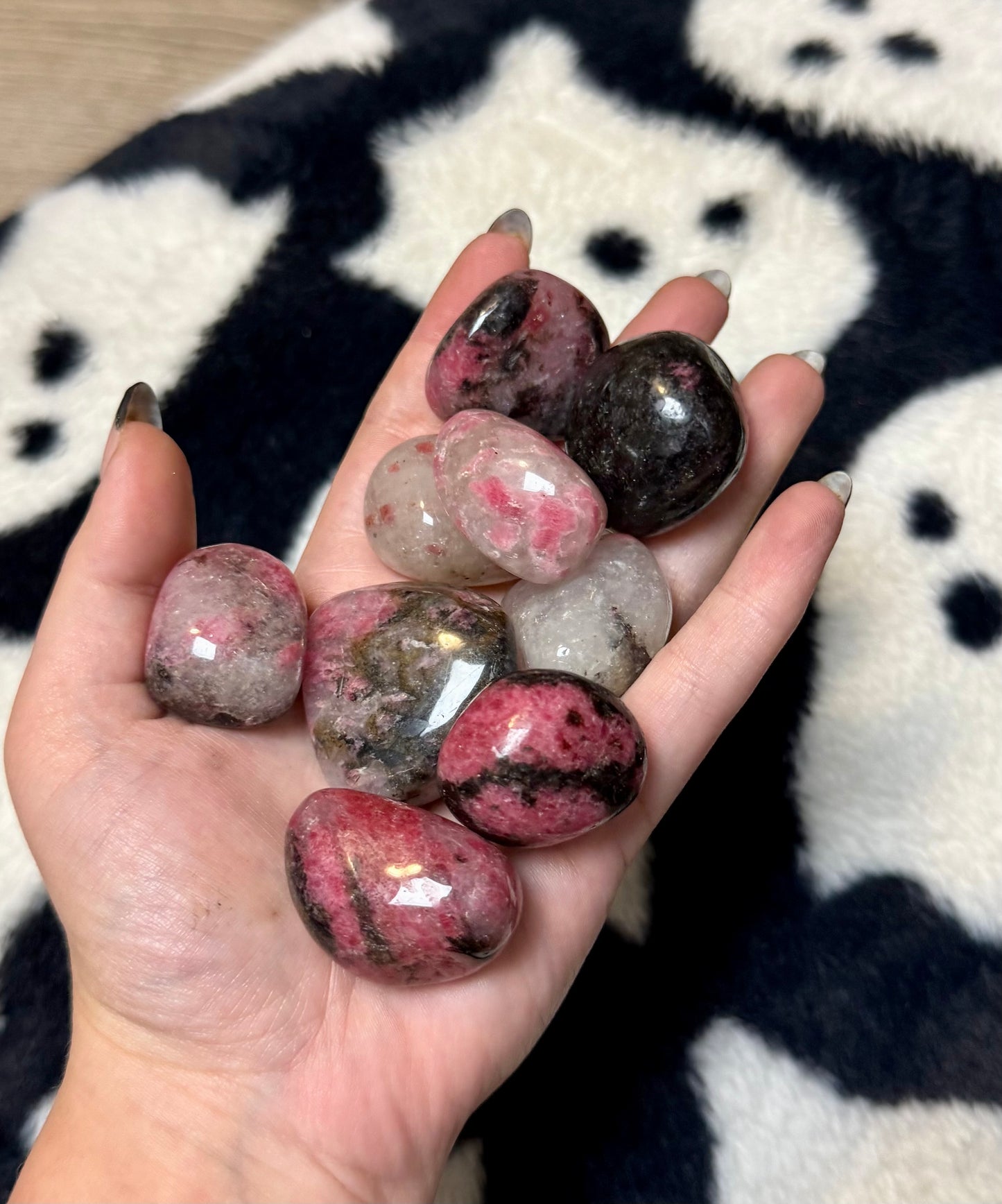 Icy rhodonite tumbles