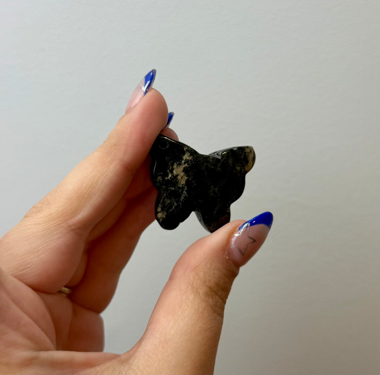 Moody rhodonite butterfly carving