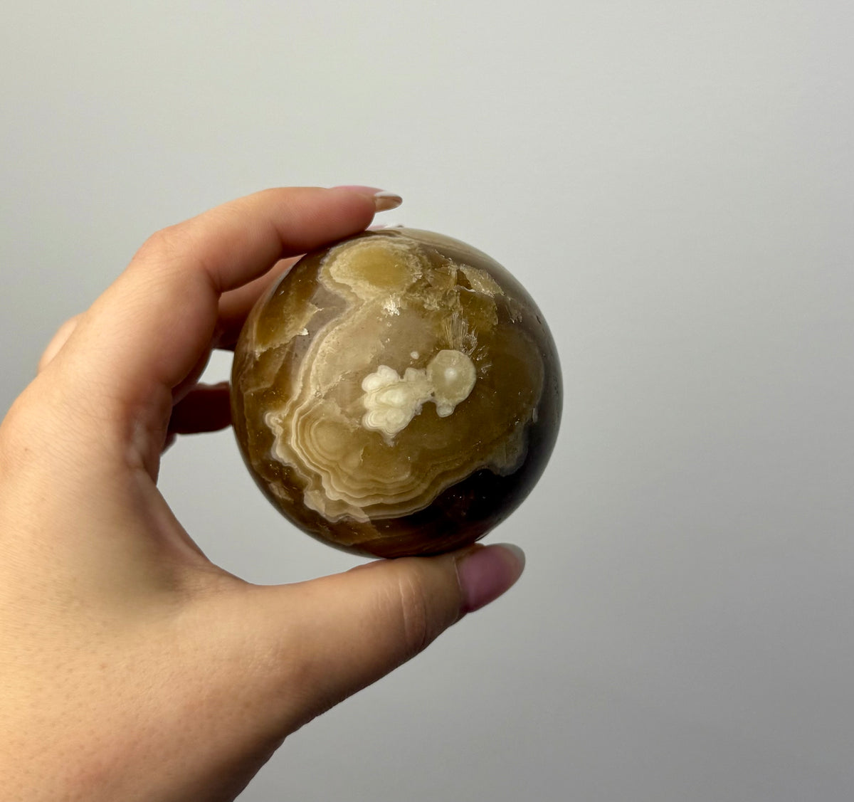 Amber calcite sphere