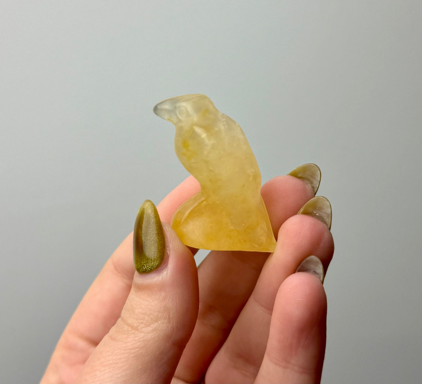Golden healer Raven carving