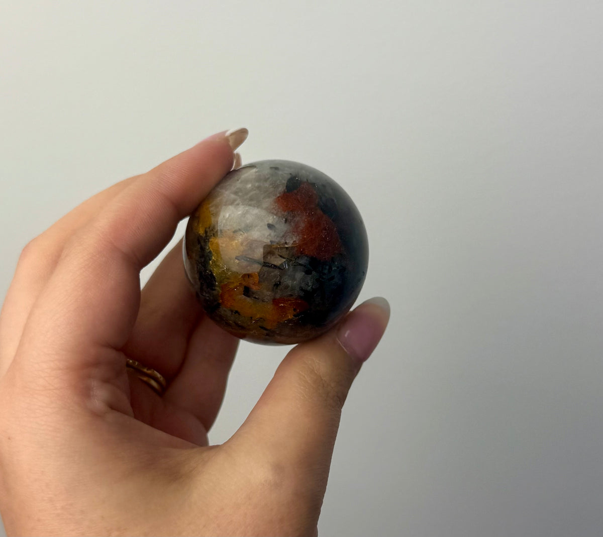 Black tourmaline in quartz sphere