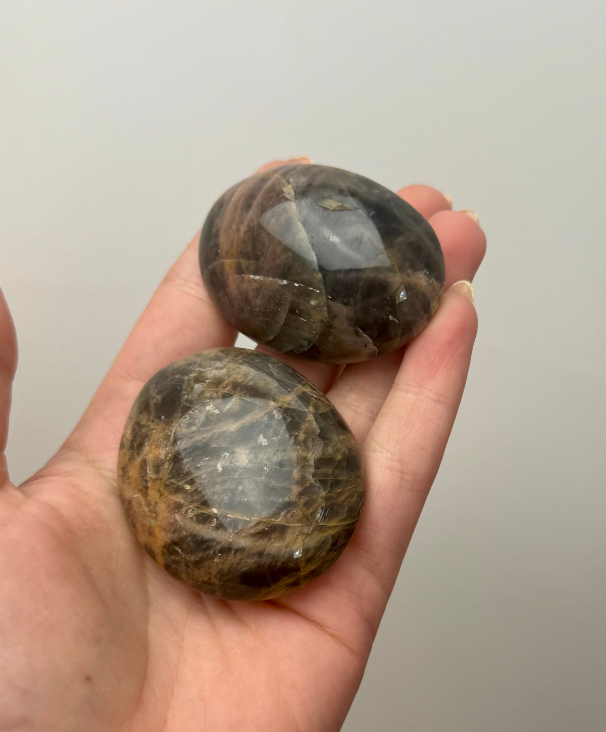 Black moonstone palm stones