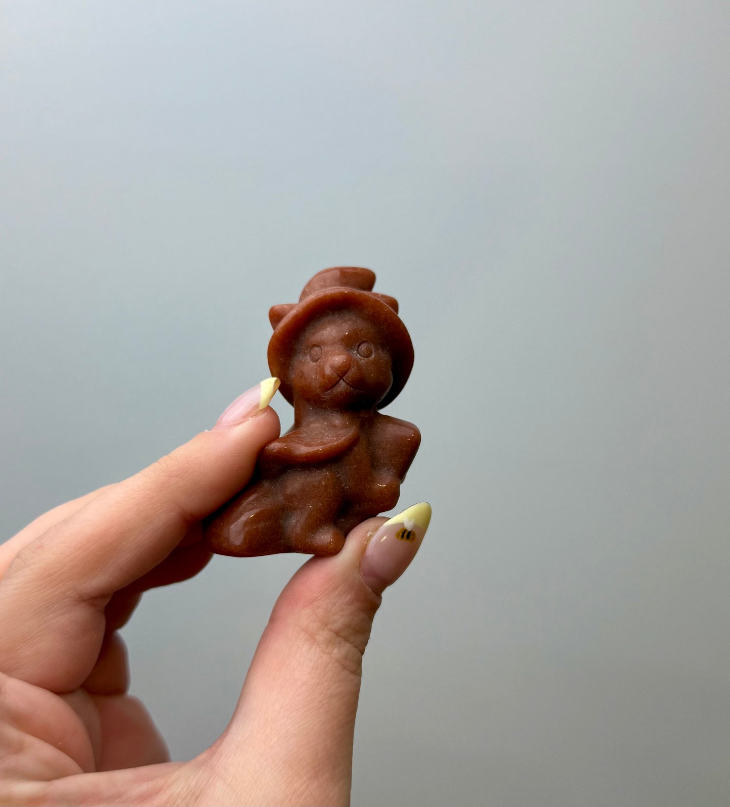 Man made material goldstone witch cat carving