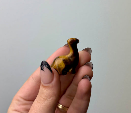 Tigers eye dinosaur carving
