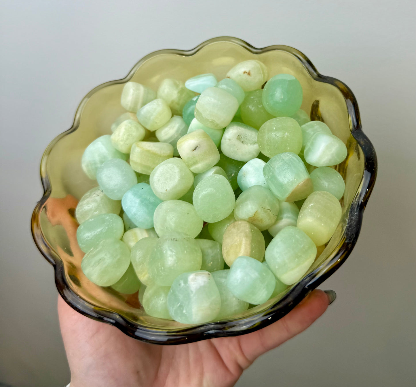Pistachio green calcite tumbles