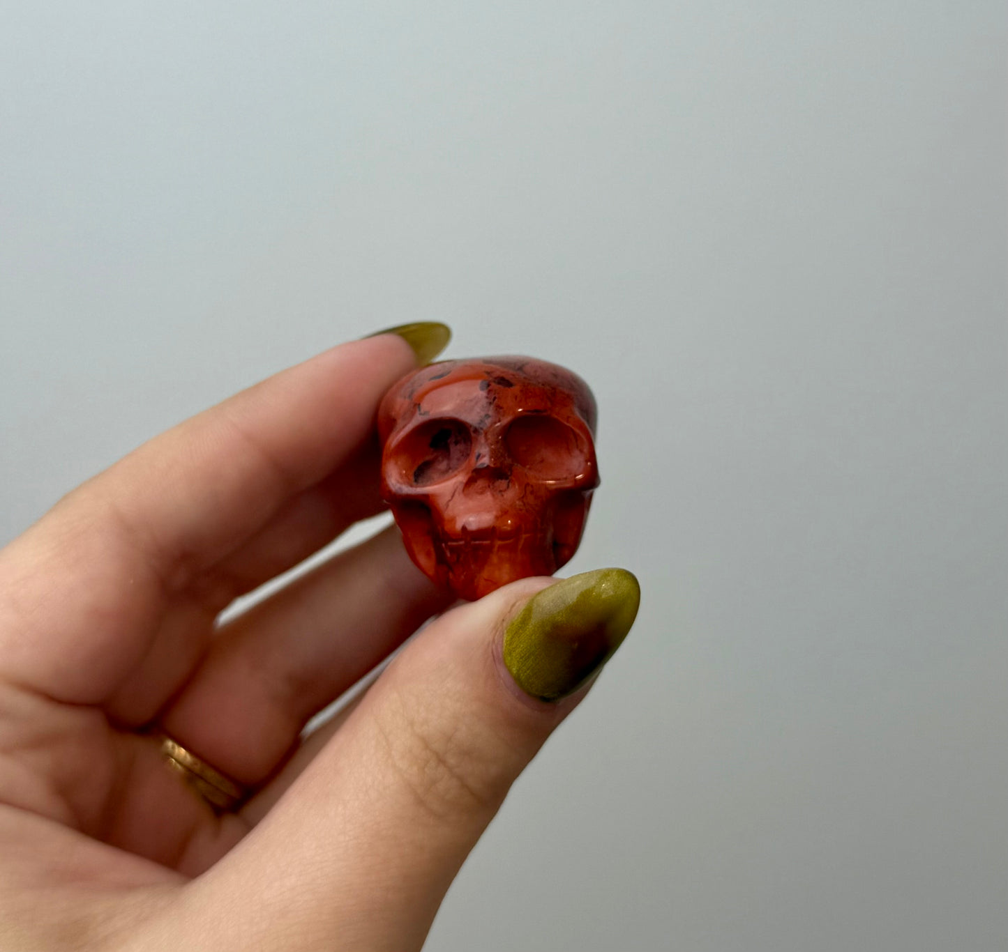 Red jasper skull carving