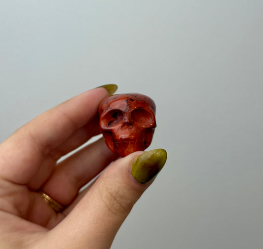 Red jasper skull carving