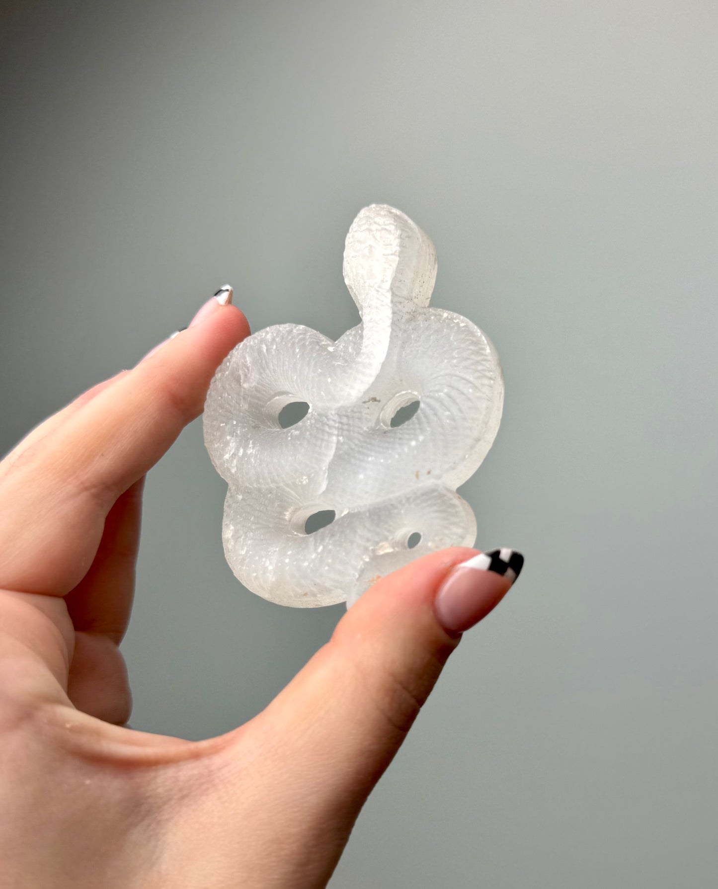 Satin spar snake carvings