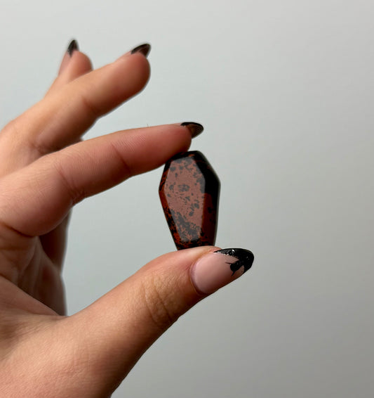 Mahogany Obsidian coffin carving