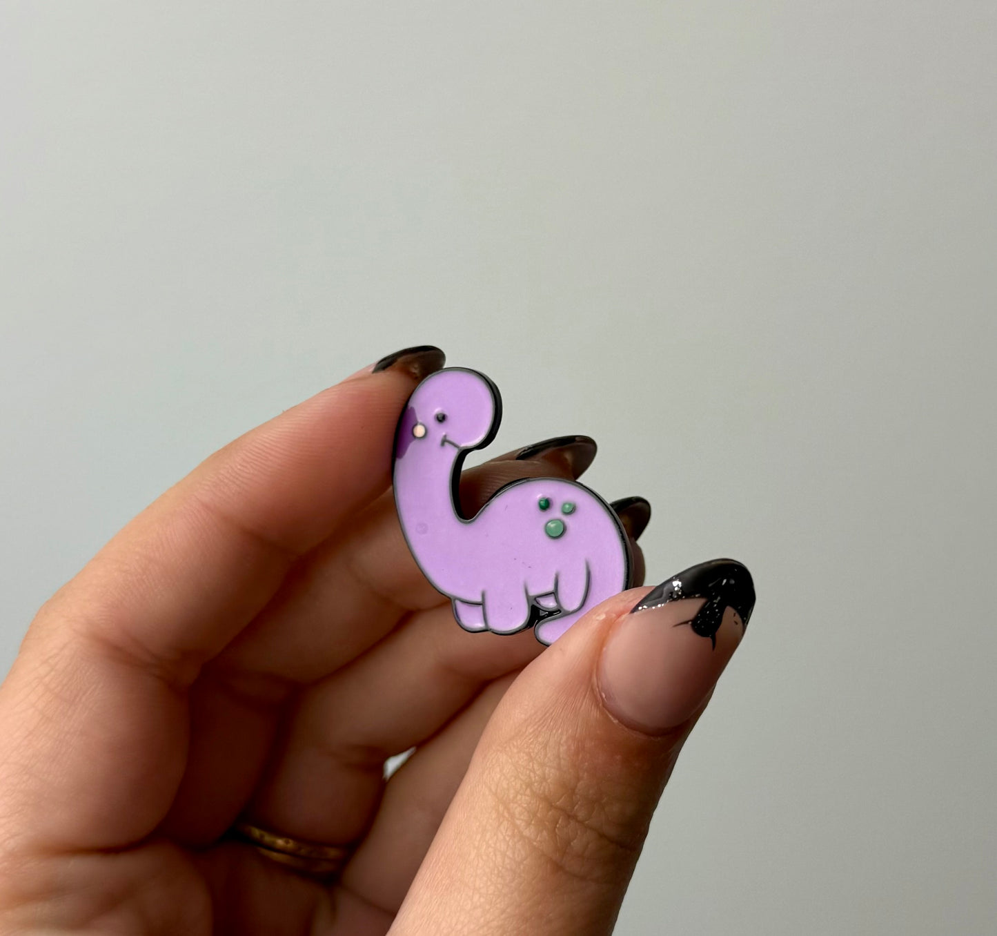 Dinosaur enamel pin