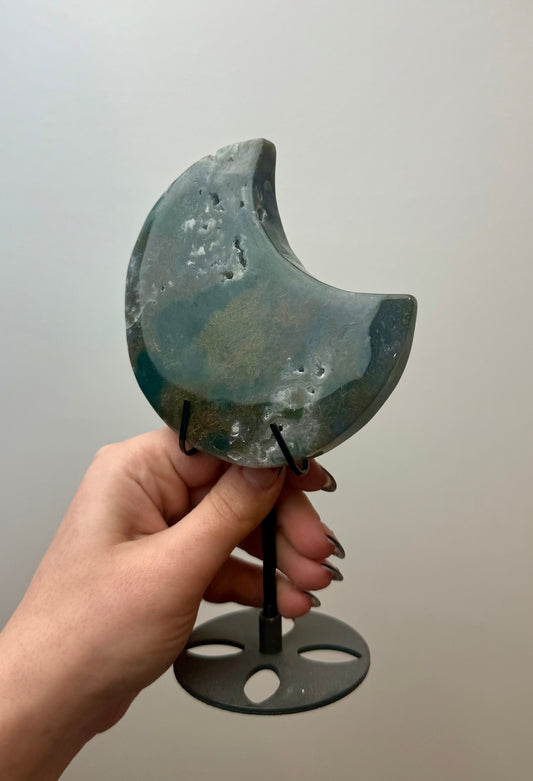 Moss agate moon carving on stand