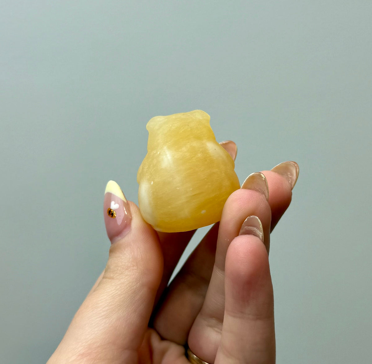Orange calcite chubby pig carving