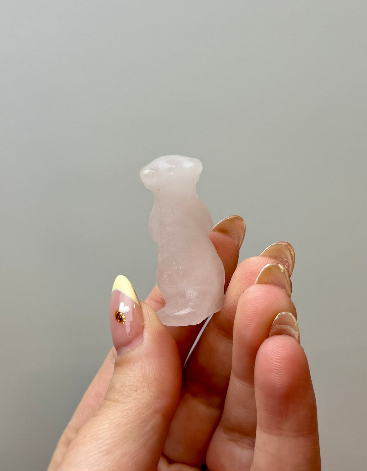 Rose quartz meerkat carving