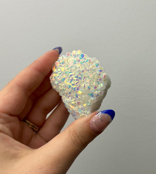 Altered aura quartz cluster