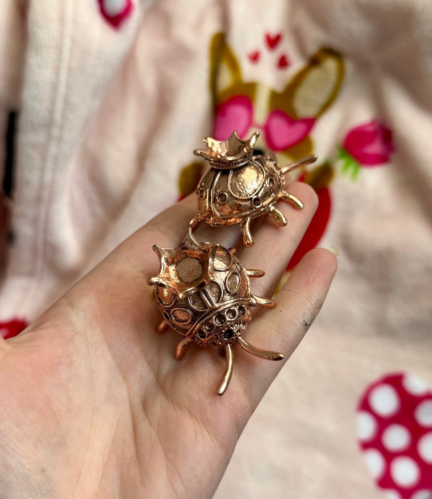 Rose gold dark ladybug sphere stands