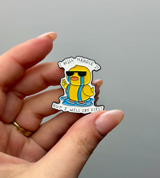Cry first duck enamel pin