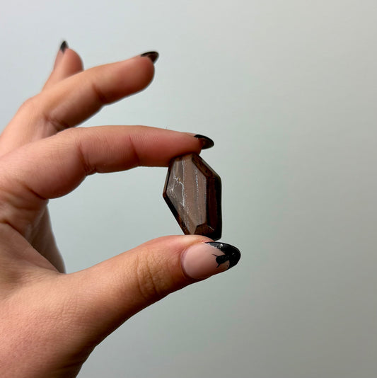 Tigers eye coffin carving