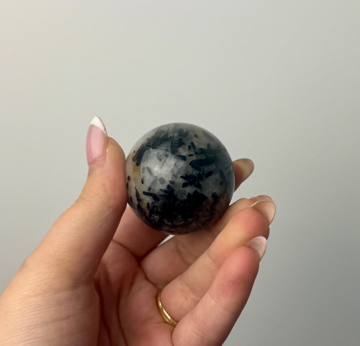 Black tourmaline in quartz sphere
