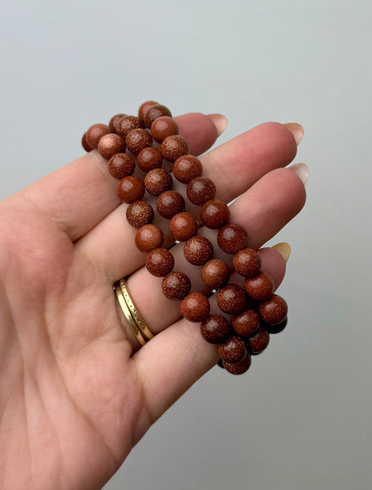 Man made material goldstone bracelets