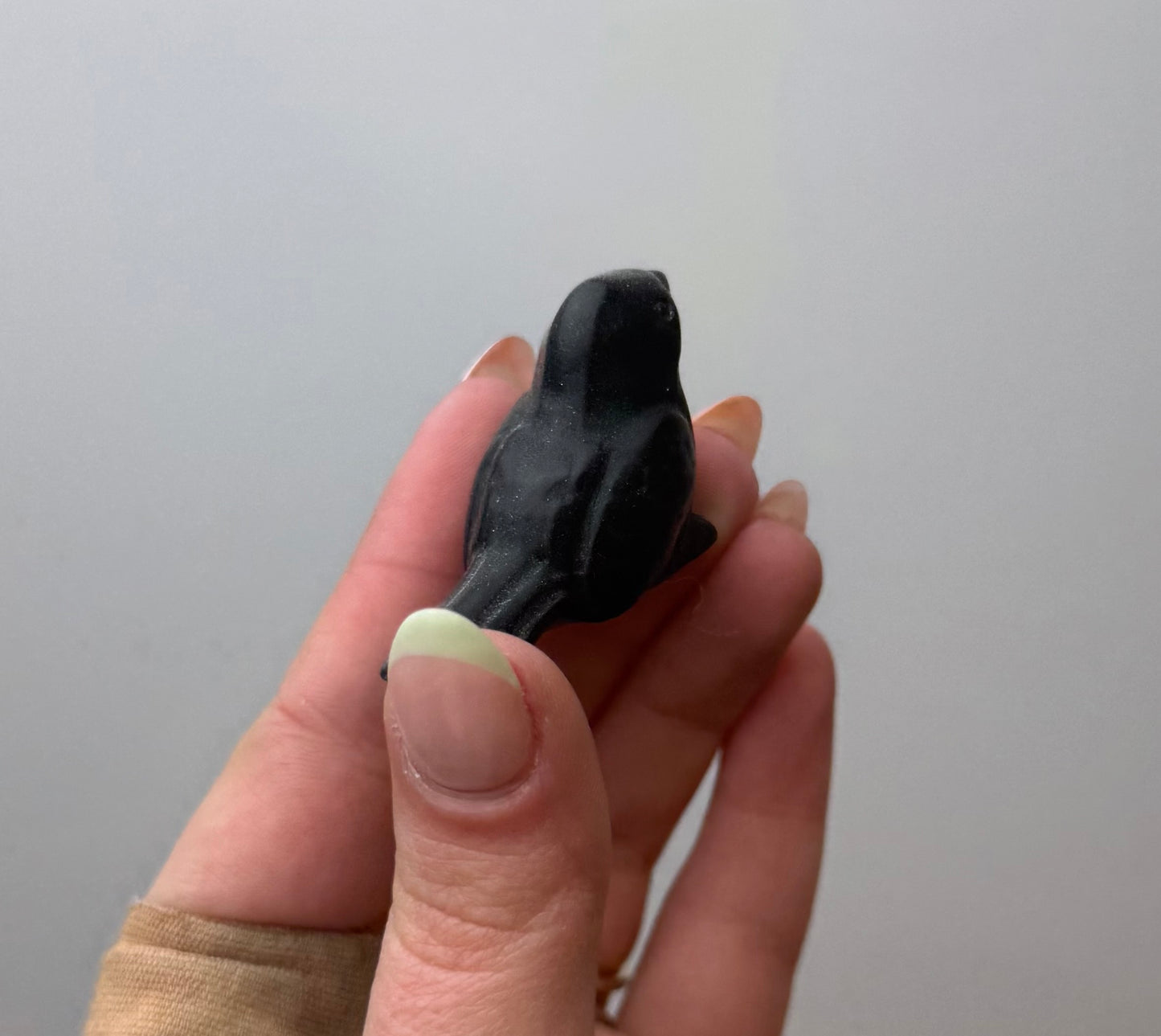 Obsidian bird carving