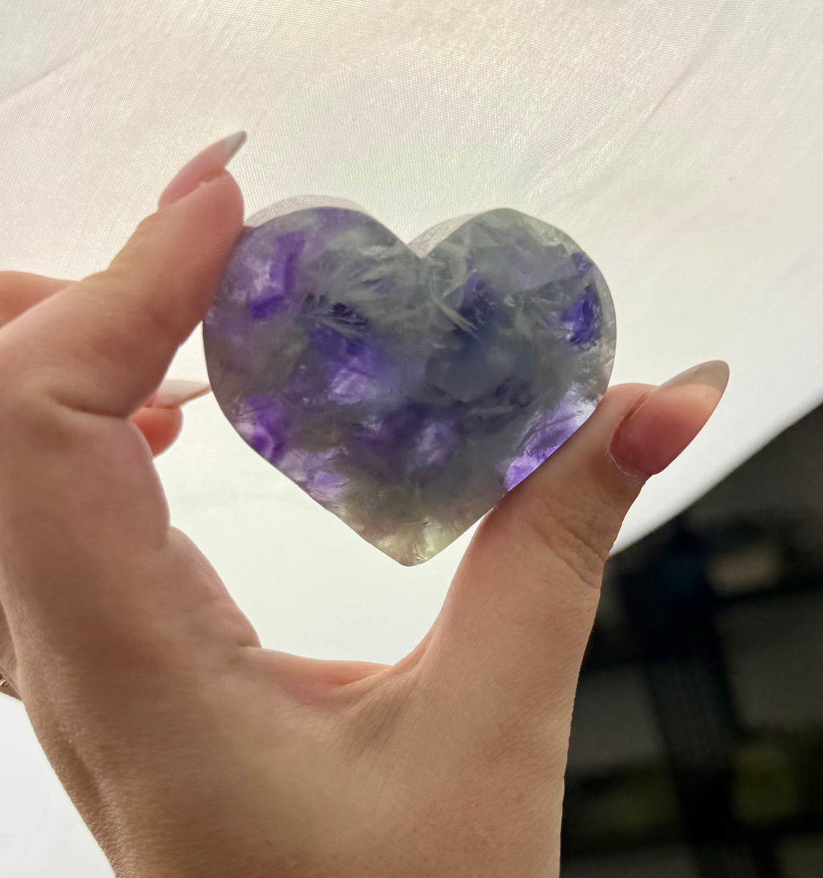 Feather fluorite heart carving