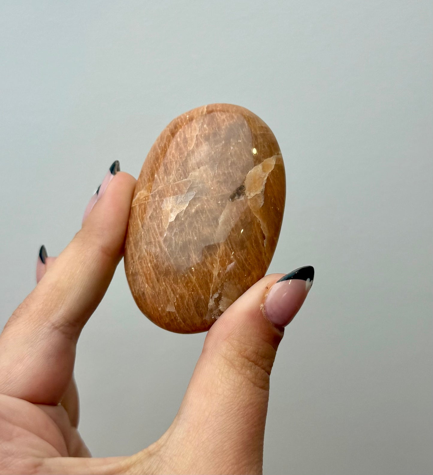 Peach moonstone palm stone