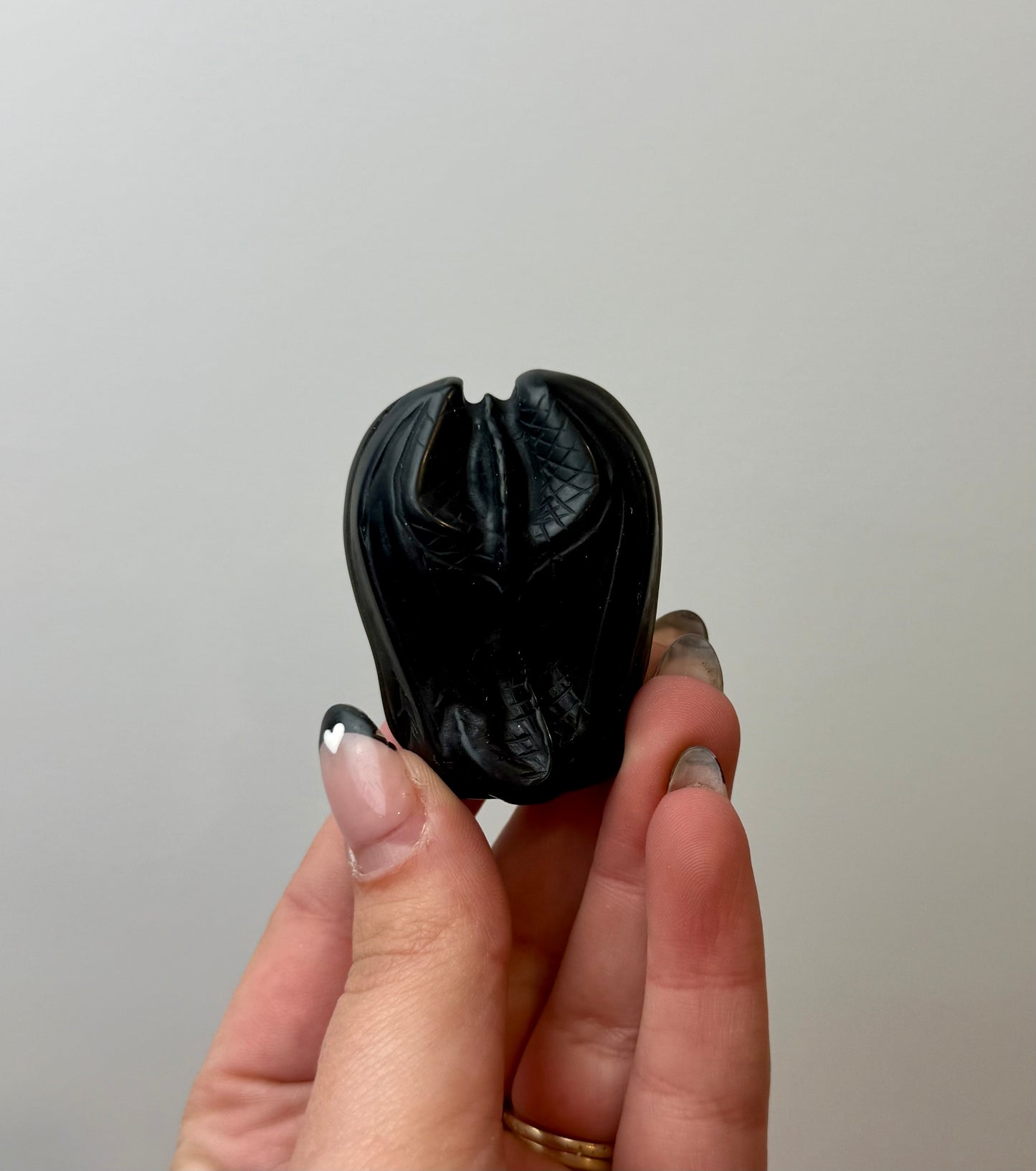 Obsidian dragon carving