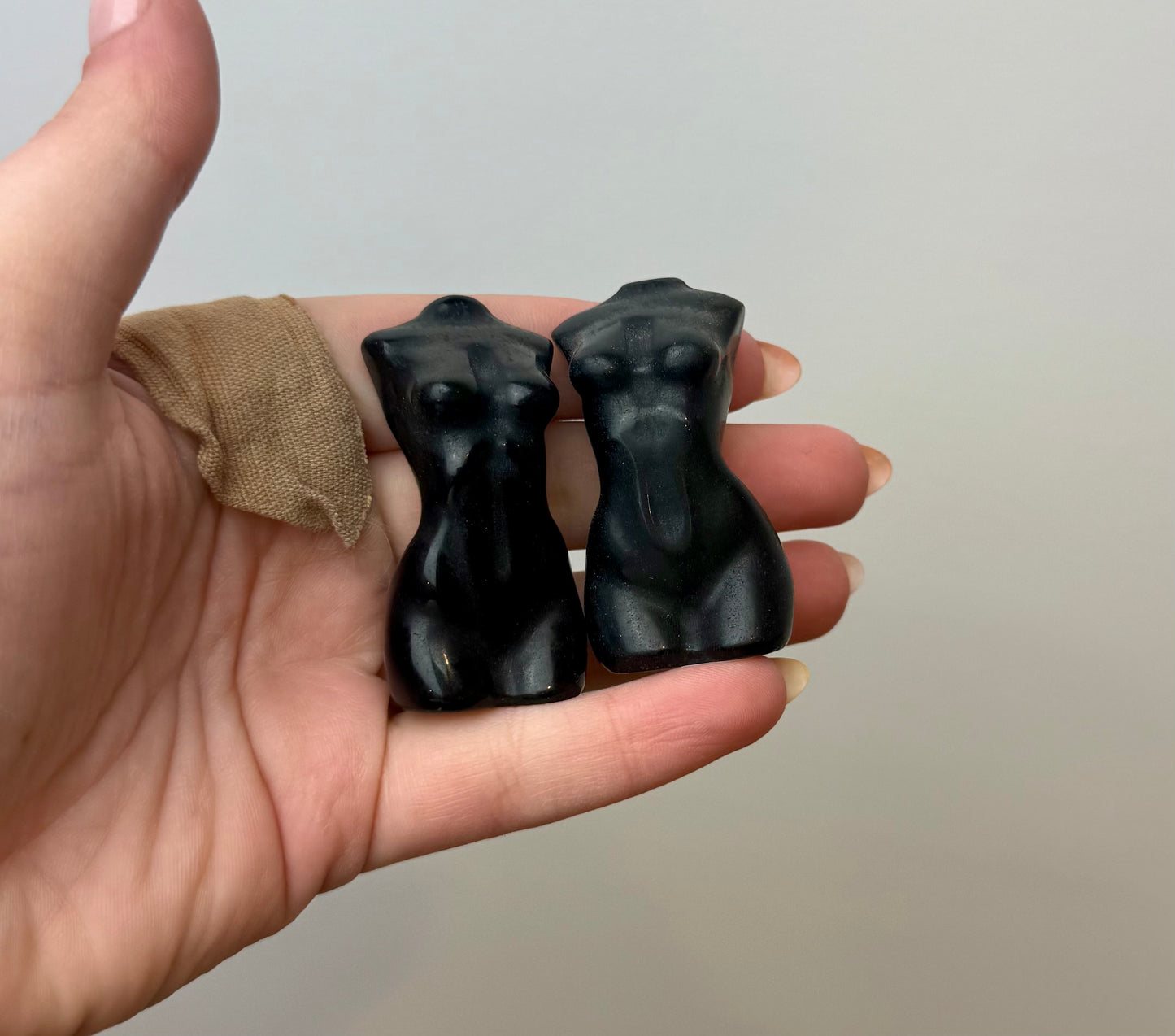 Obsidian woman body carvings