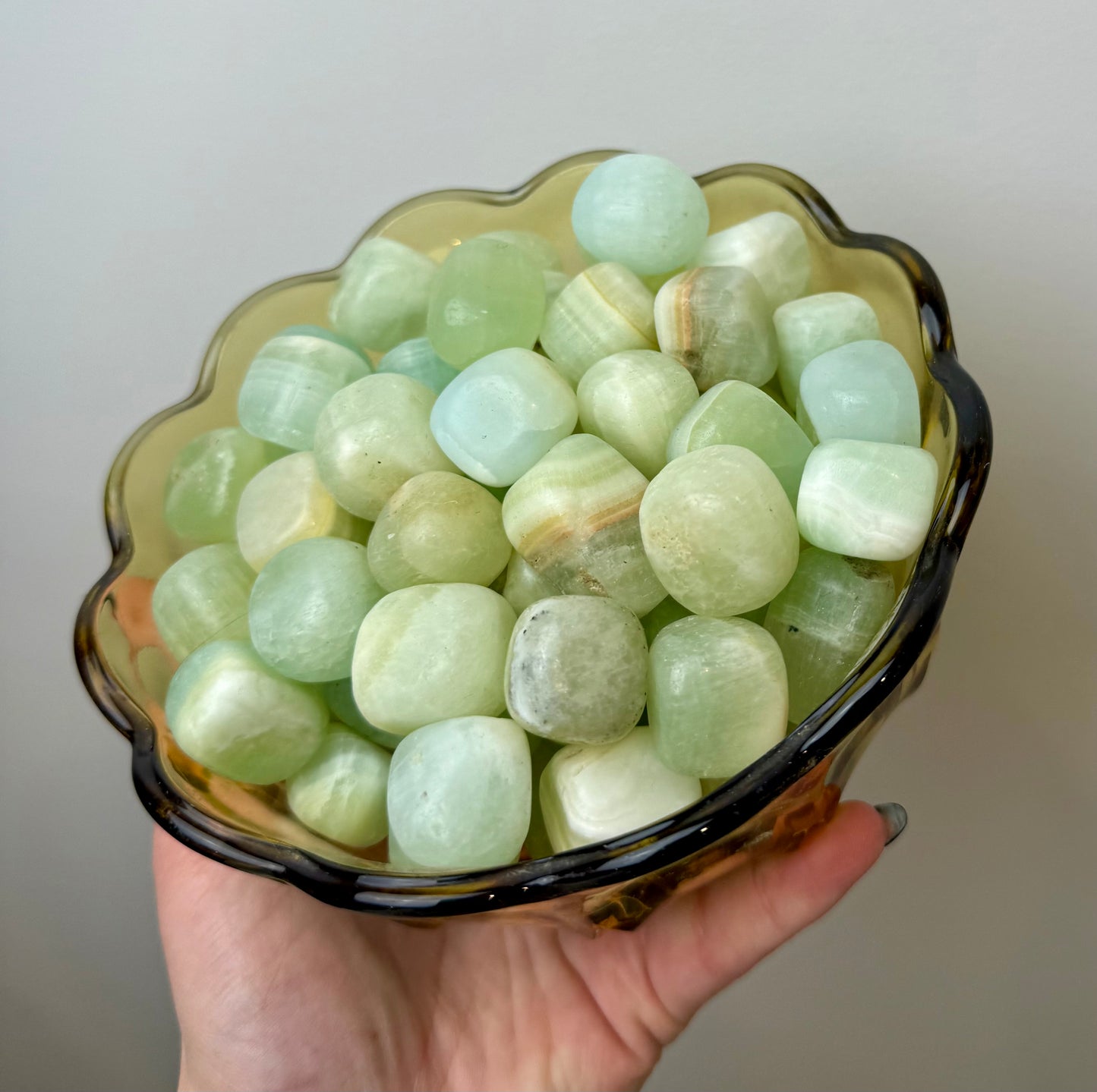 Pistachio green calcite tumbles