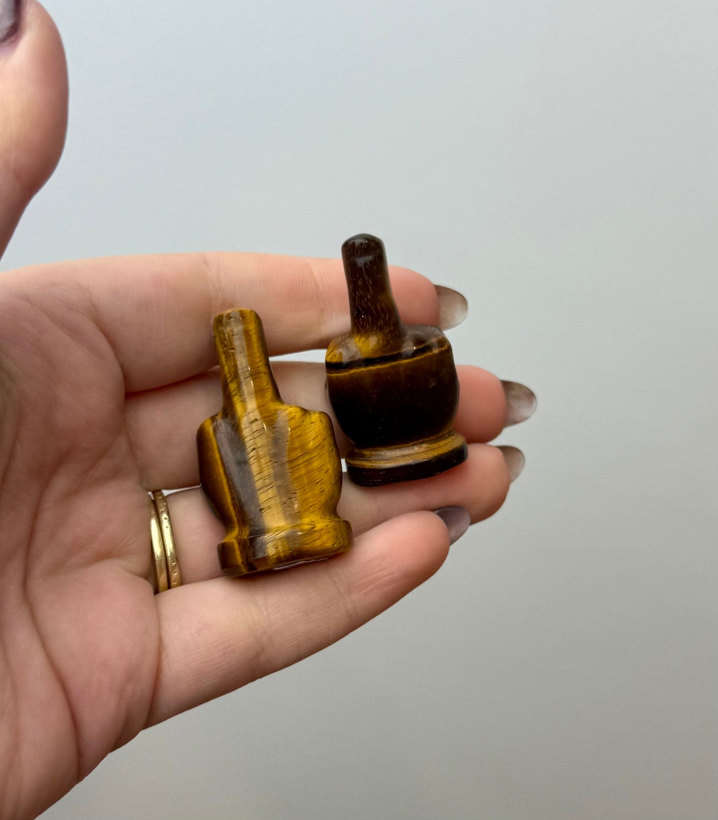 Tigers eye middle finger carvings