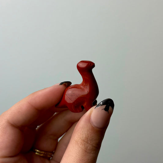 Red jasper dinosaur carving