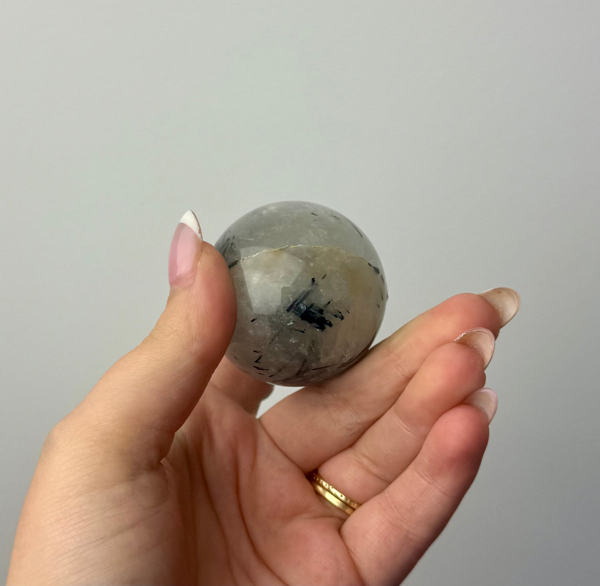 Black tourmaline in quartz sphere