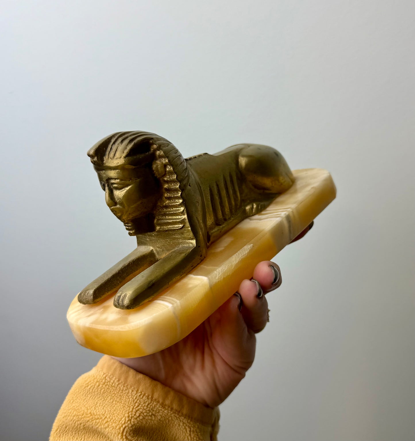 Orange calcite Spinx carving thrifted find ￼￼