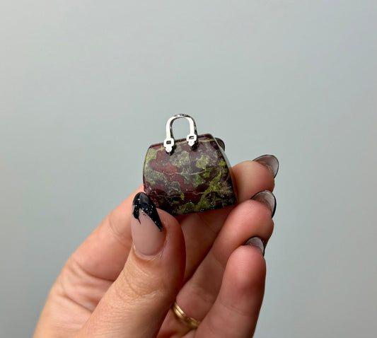 Dragon blood jasper purse carving