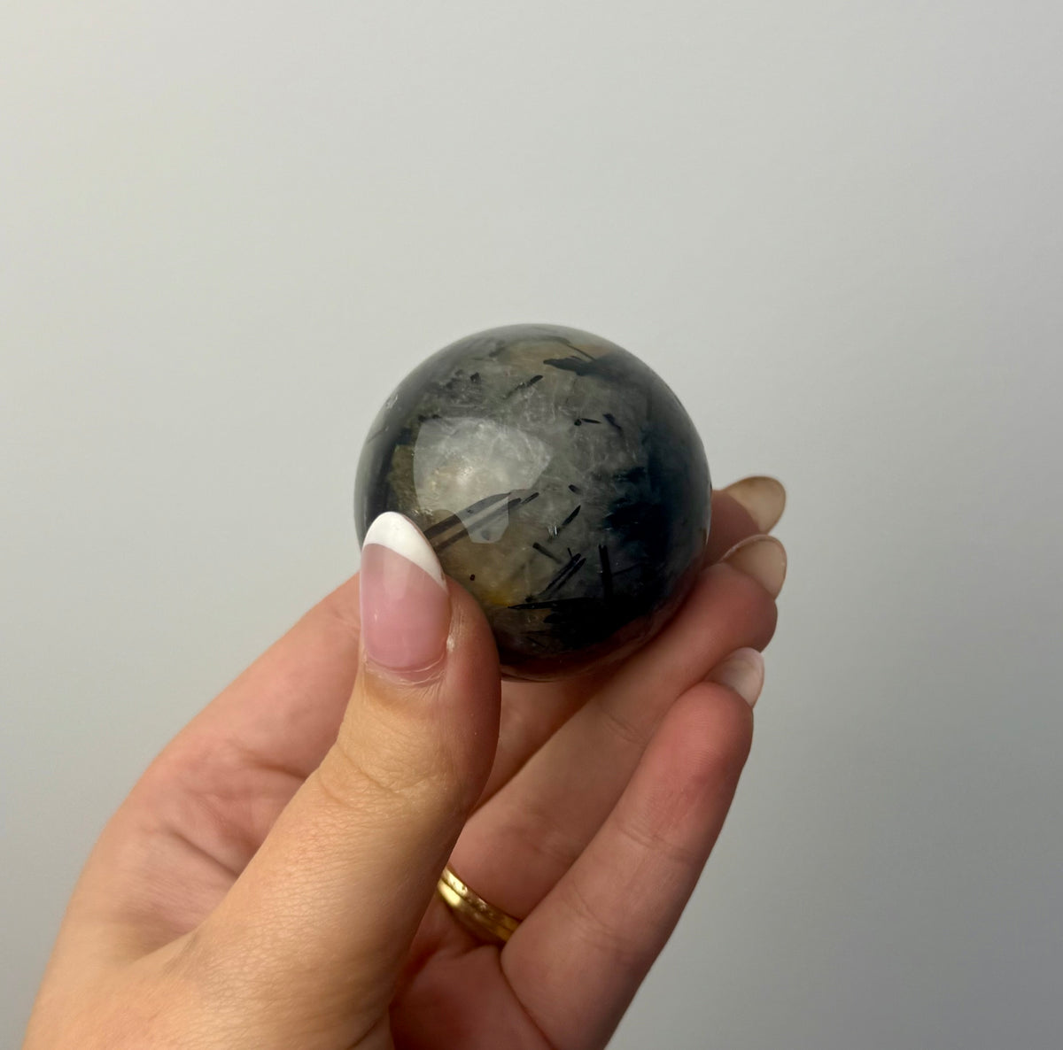 Black tourmaline in quartz sphere