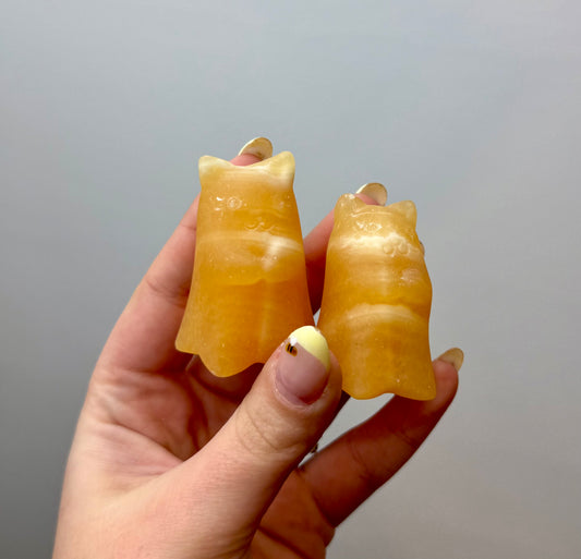 Orange calcite ghost cat carvings