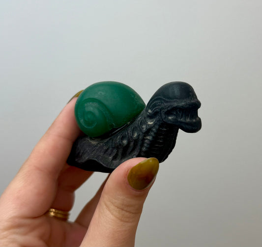 Alien snail carving