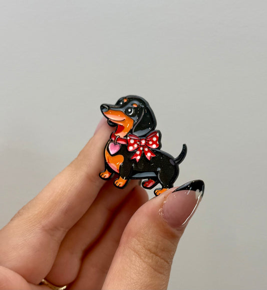 Wiener dog dachshund with a bow enamel pin ￼