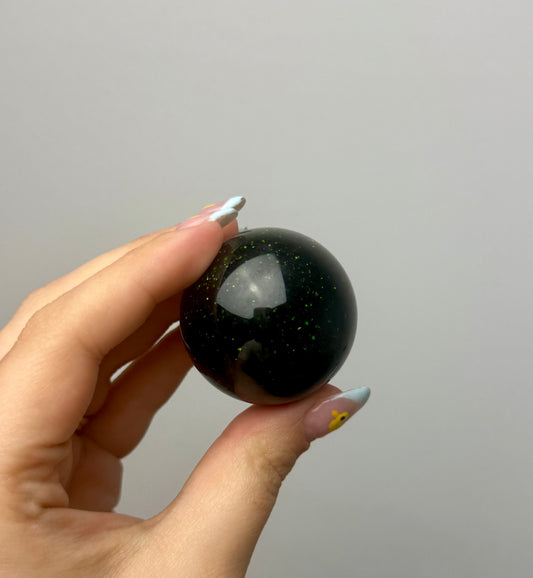 Green goldstone man made material sphere