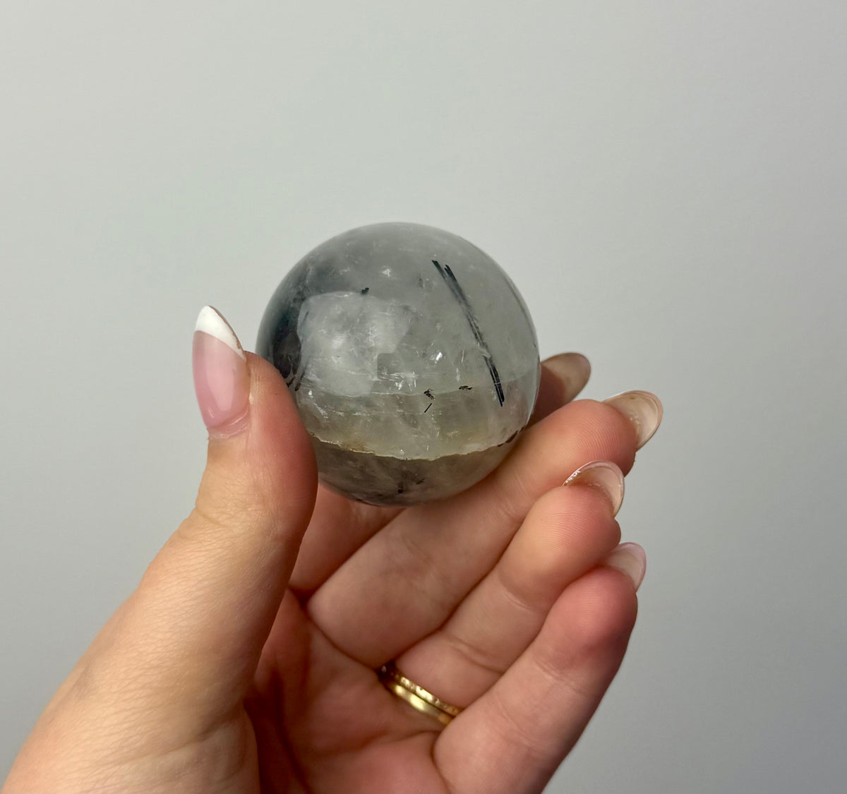Black tourmaline in quartz sphere