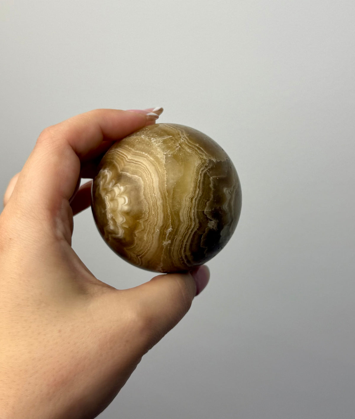 Amber calcite sphere