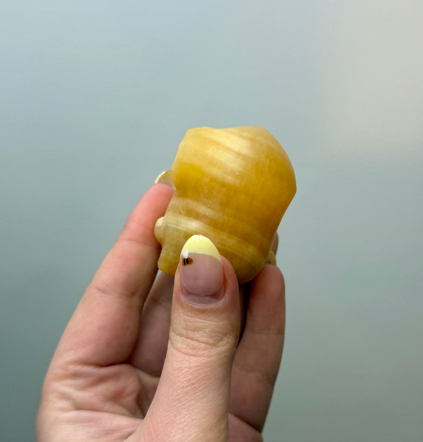 Orange calcite minion carving