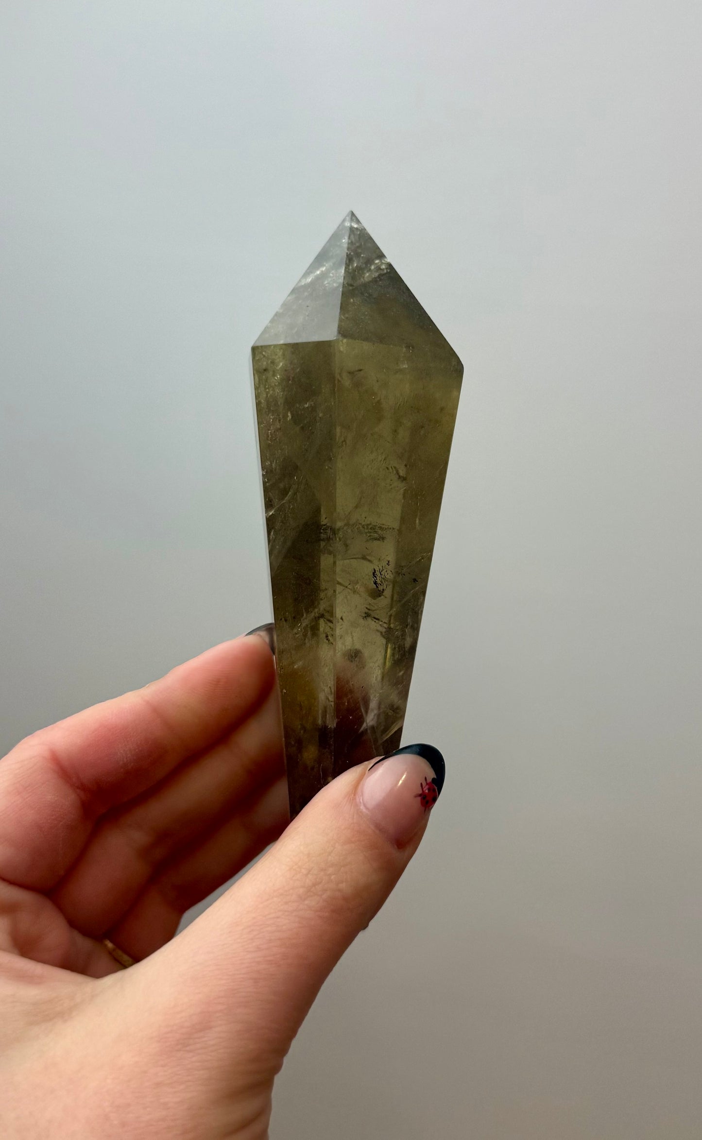 Smoky quartz wand on a stand