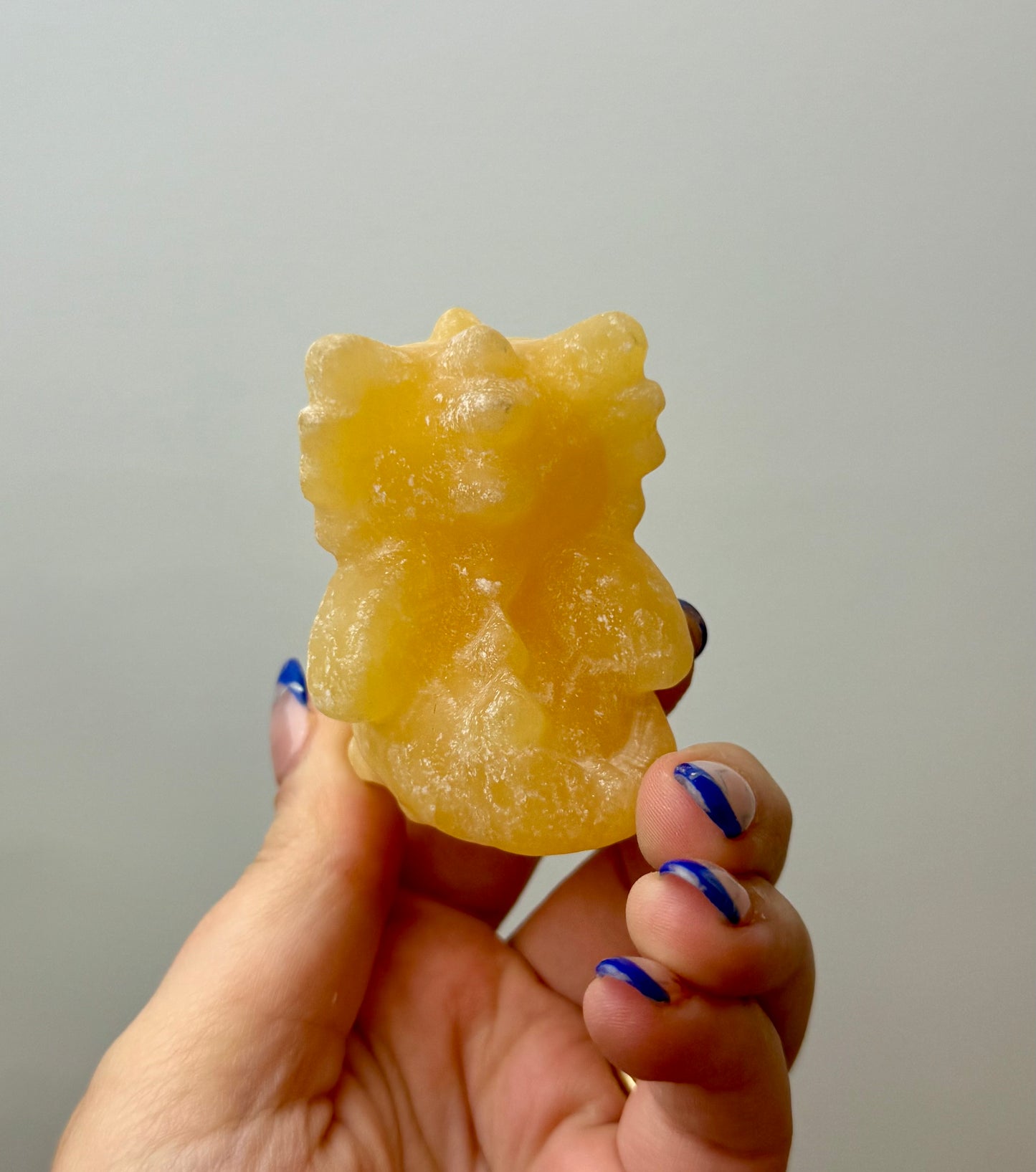 Orange calcite dragon carving