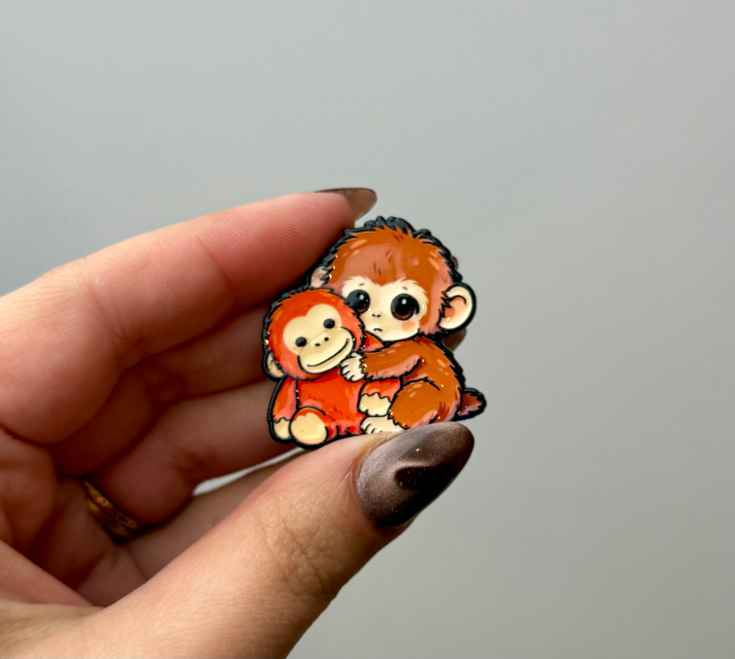 Punch the monkey enamel pin